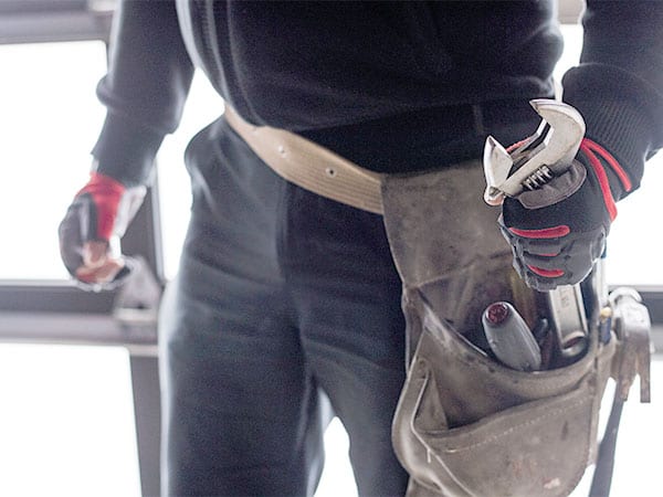 Man with tool belt.